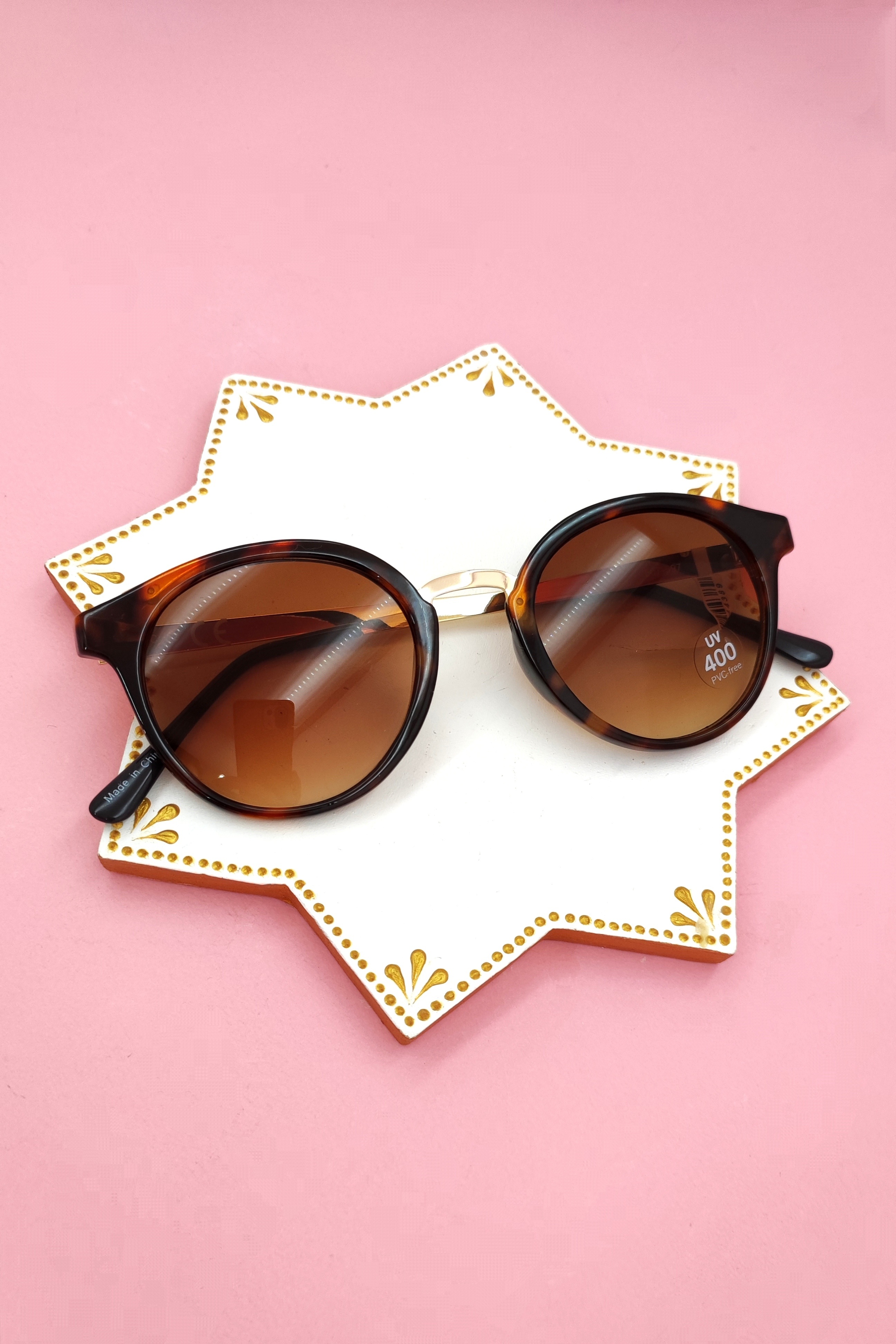 عینک آفتابی اورجینال زنانه شیشه گرد دسته فلزی هولدردار رنگ هاوانا